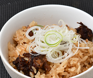 Gyu Suji Toro Ni rice seasoned and cooked with various ingredients