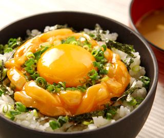 Raw Egg and Sea Urchin and Squid mix on Rice